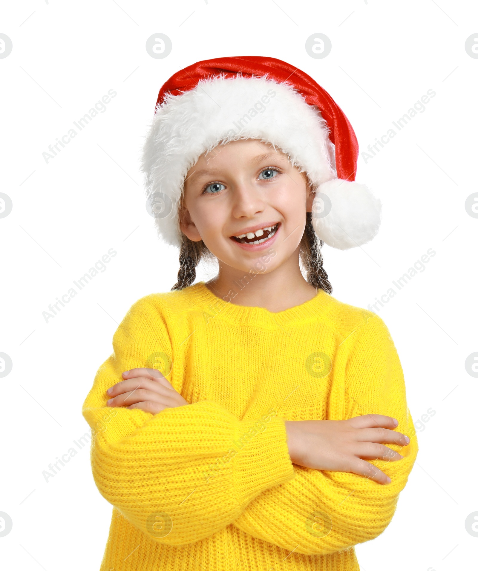 Photo of Happy little child in Santa hat on white background. Christmas celebration