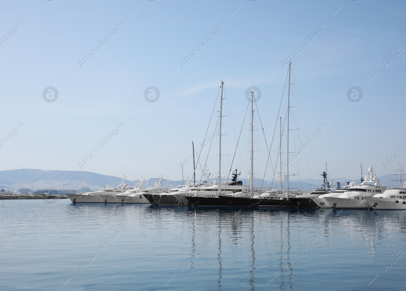 Photo of Beautiful view of different boats at pier on sunny day