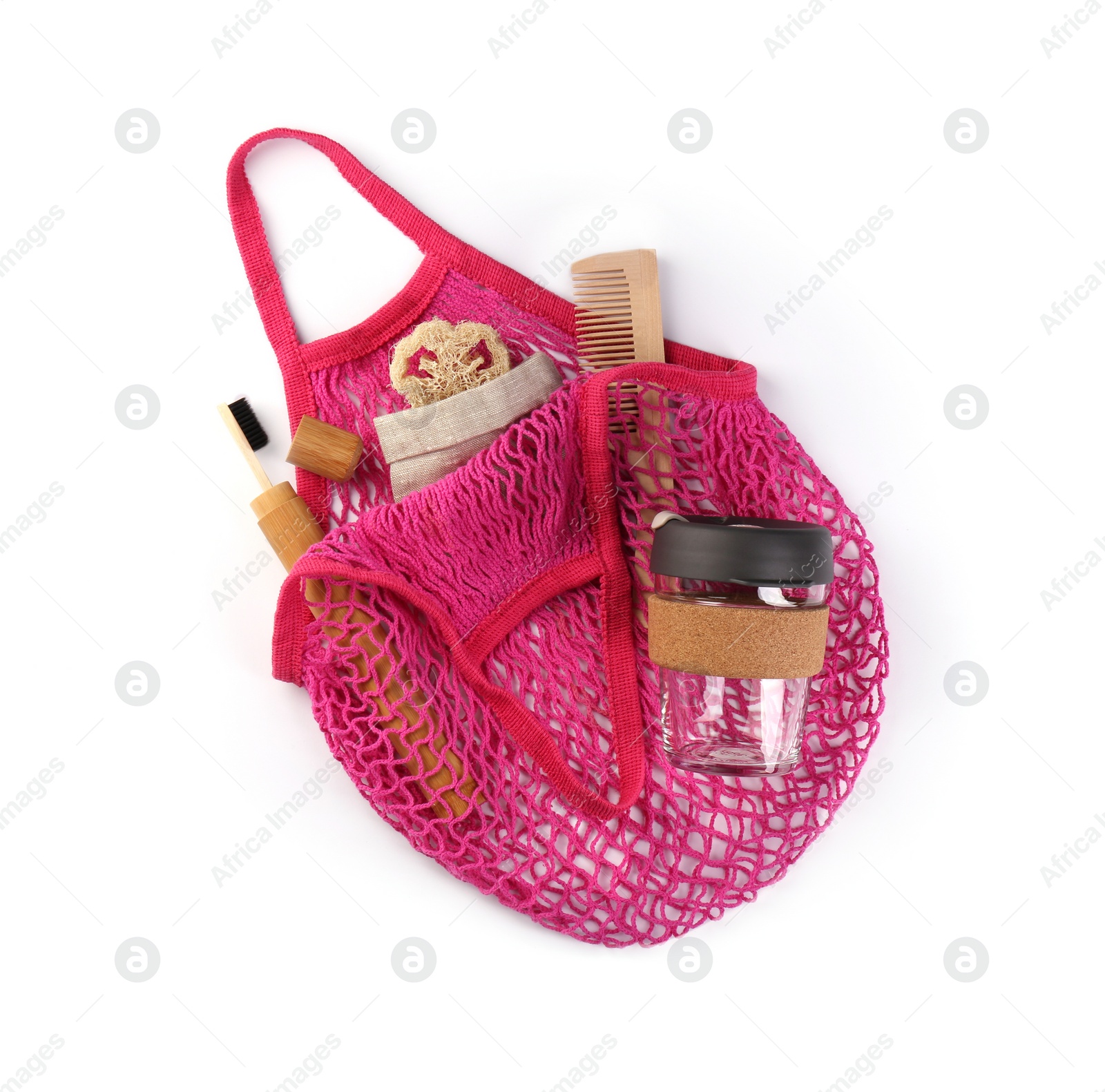 Photo of Mesh bag with different items isolated on white, top view. Conscious consumption