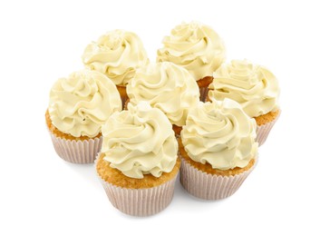 Photo of Tasty vanilla cupcakes with cream isolated on white