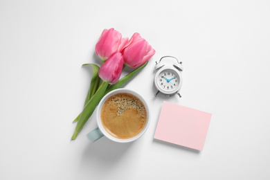 Composition with blank card and coffee on white background, top view. Good morning