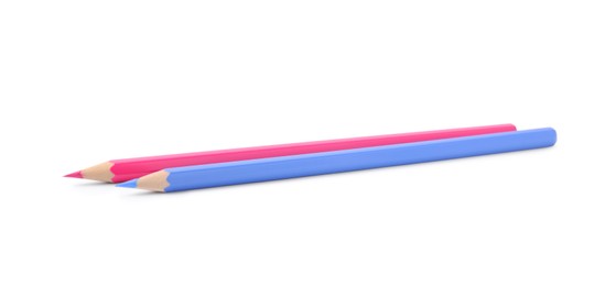 Photo of New light blue and pink wooden pencils on white background