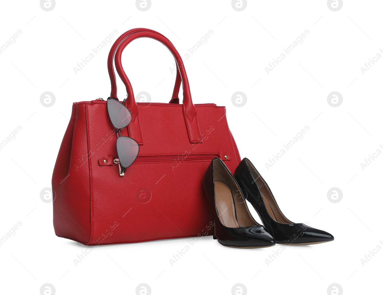 Photo of Stylish woman's bag, sunglasses and shoes isolated on white