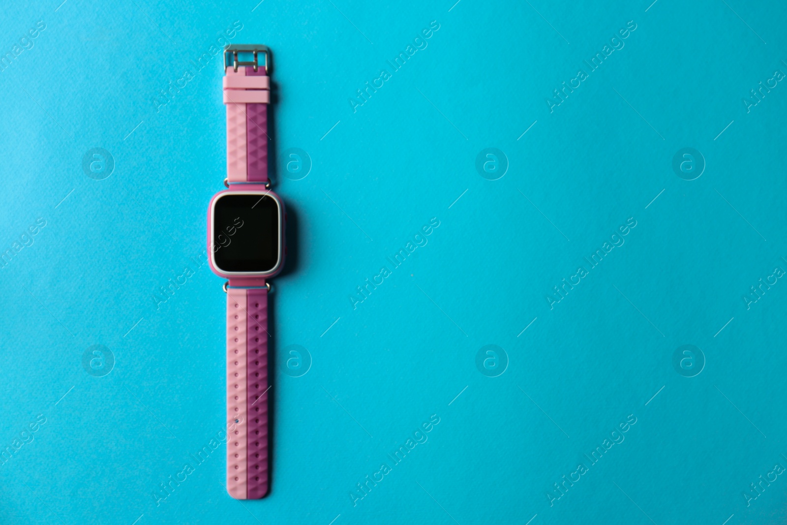 Photo of Kid smart watch on light blue background, top view. Space for text