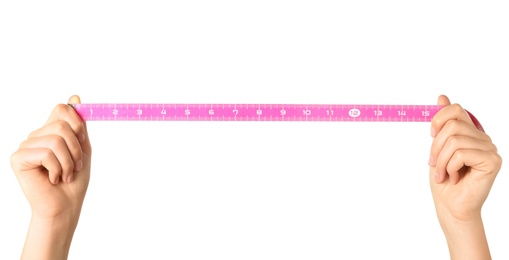 Photo of Woman holding pink measuring tape on white background, closeup
