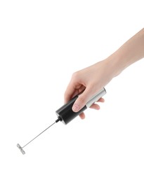 Photo of Woman holding milk frother wand on white background, closeup