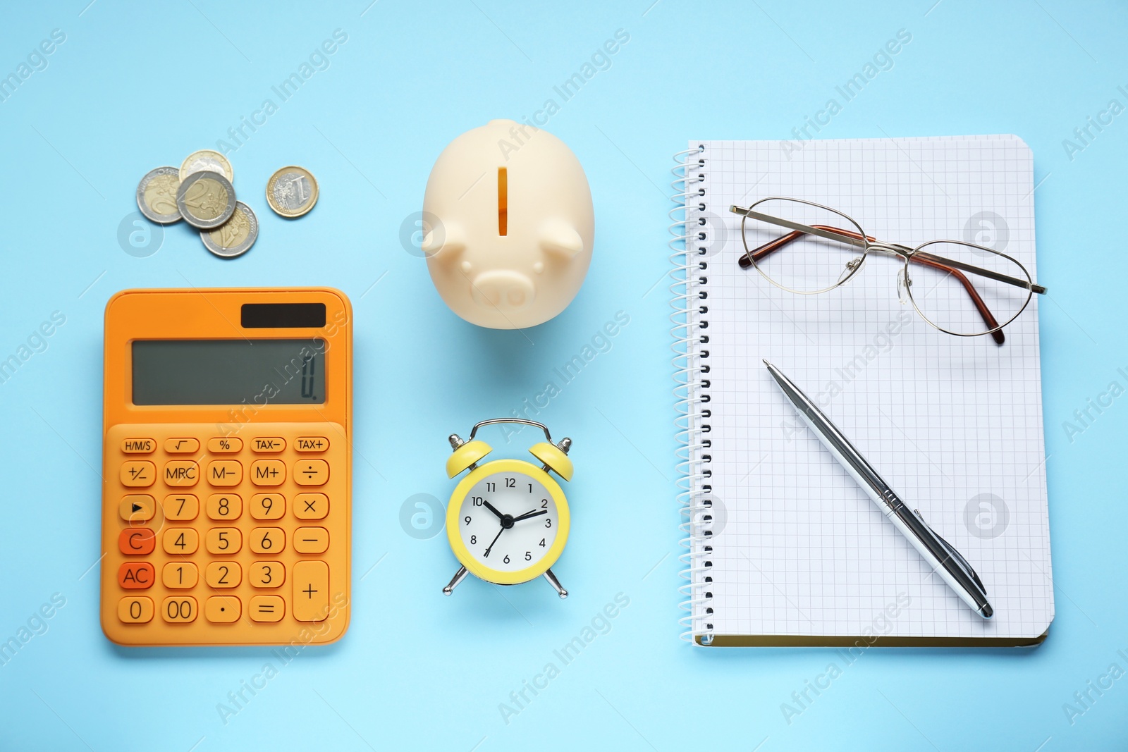 Photo of Flat lay composition with piggy bank and coins on light blue background