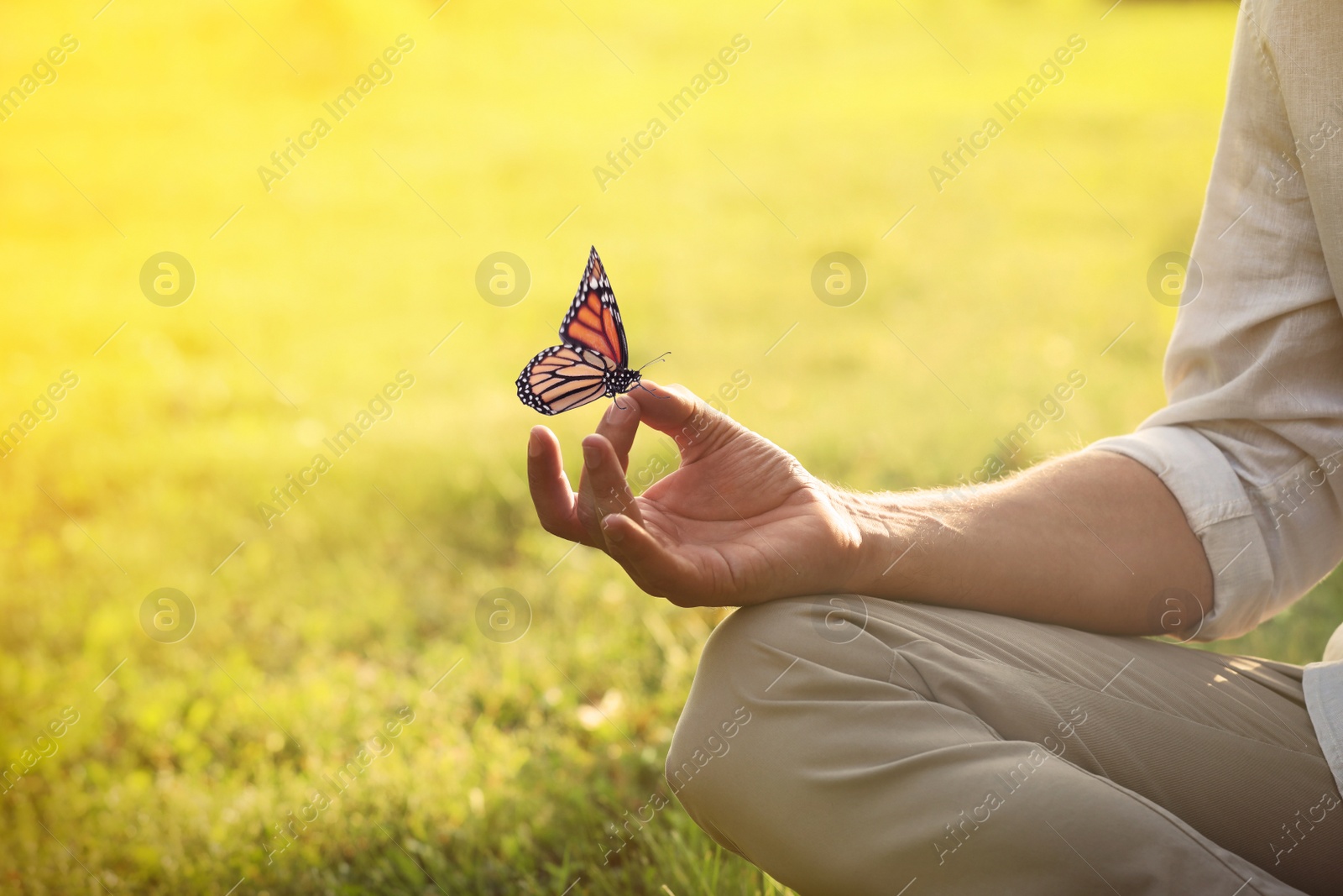 Image of Man meditating outdoors on sunny day, closeup. Space for text