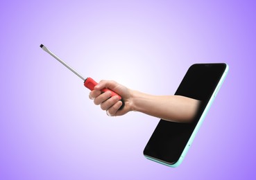 Image of Repair service - just call. Closeup view of man with screwdriver and smartphone on violet background