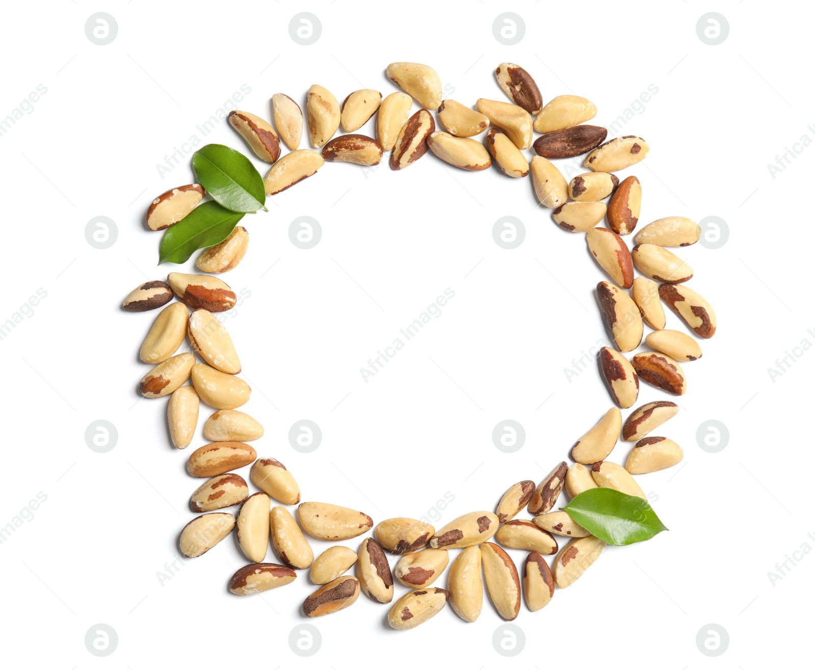 Photo of Composition with Brazil nuts, leaves and space for text on white background, top view