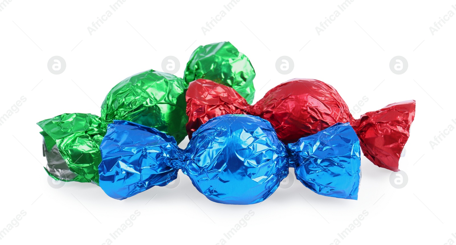 Photo of Tasty candies in colorful wrappers isolated on white