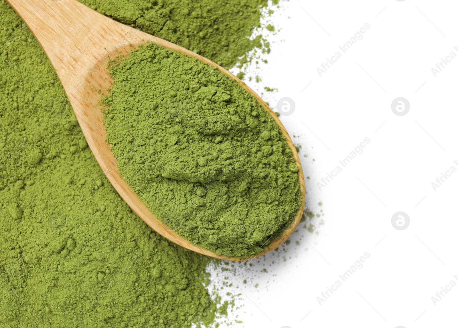 Photo of Green matcha powder and wooden spoon isolated on white, top view