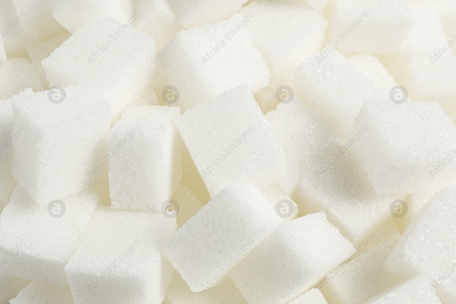 Photo of White sugar cubes as background, closeup view