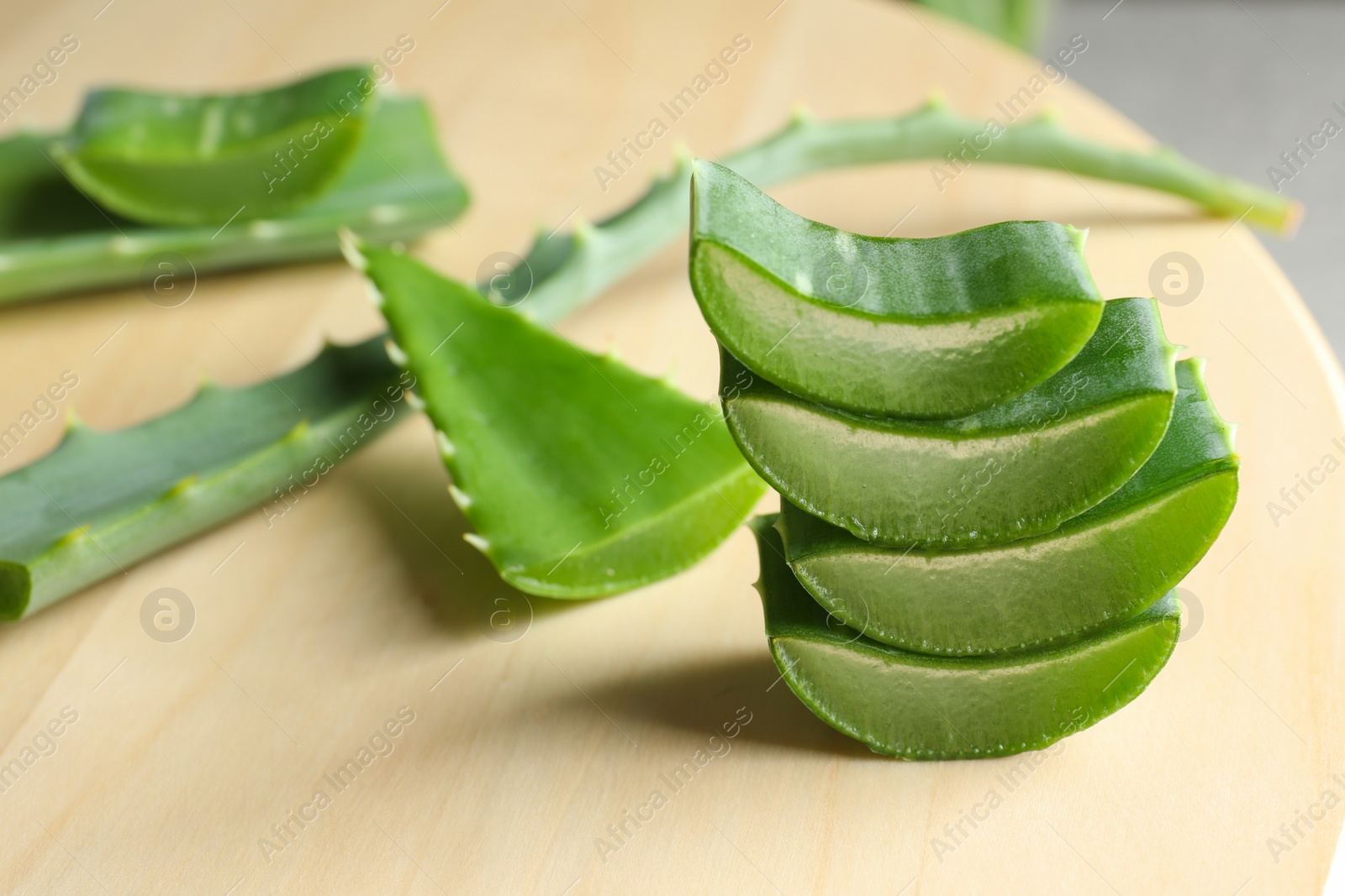 Photo of Fresh sliced aloe vera leaves on light table