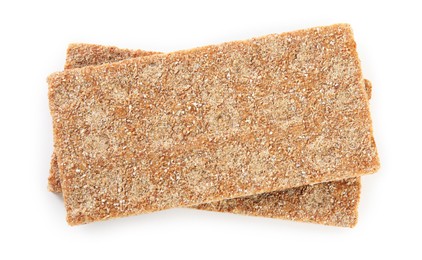 Photo of Fresh crunchy rye crispbreads on white background, top view