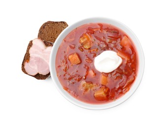 Tasty borscht, sour cream and bread with ham isolated on white, top view