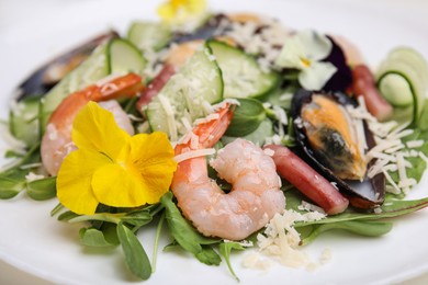Photo of Plate of delicious salad with seafood, closeup view