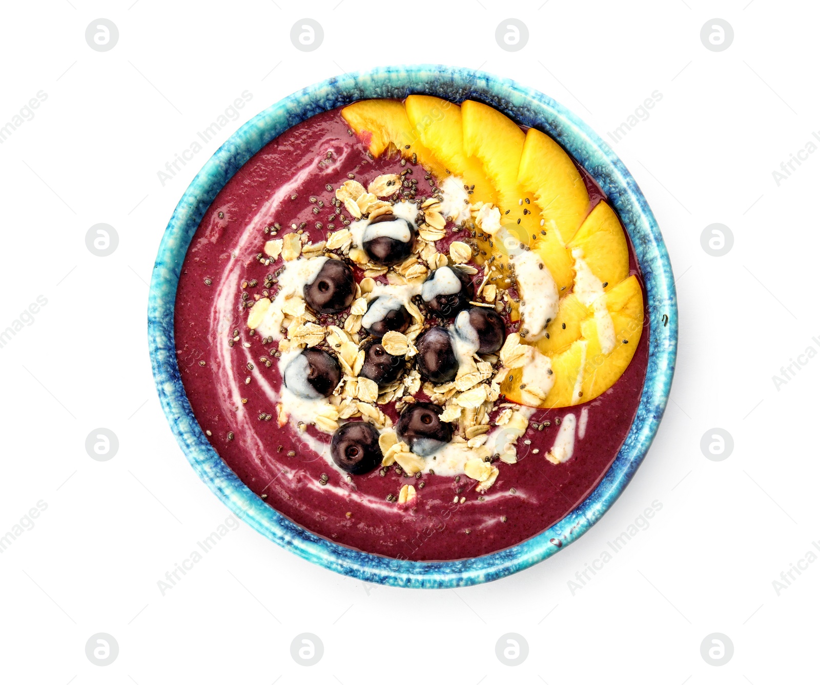 Photo of Bowl with tasty acai smoothie on white background, top view