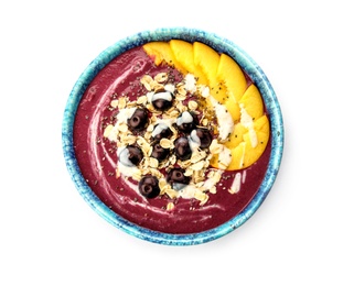 Photo of Bowl with tasty acai smoothie on white background, top view