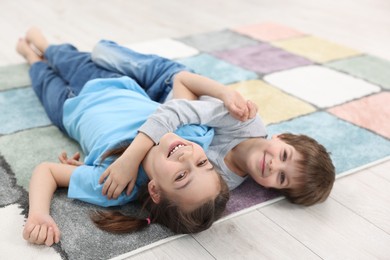 Photo of Happy brother and sister spending time together indoors