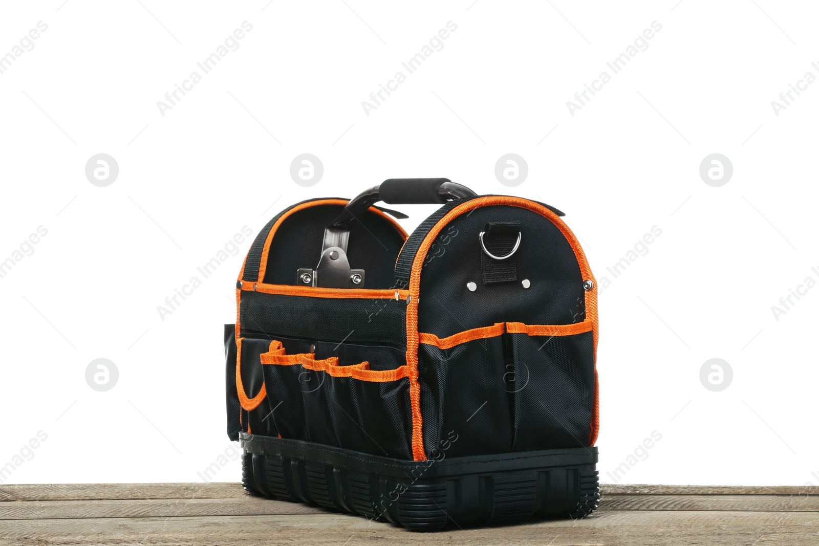 Photo of Empty bag for tools on wooden table against white background