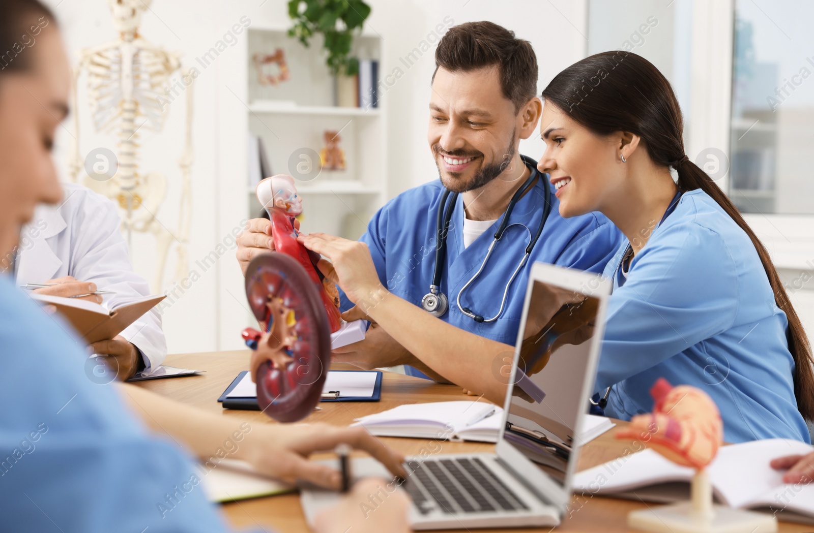 Photo of Medical students in uniforms studying at university