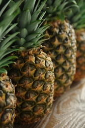 Photo of Closeup view of fresh ripe juicy pineapples