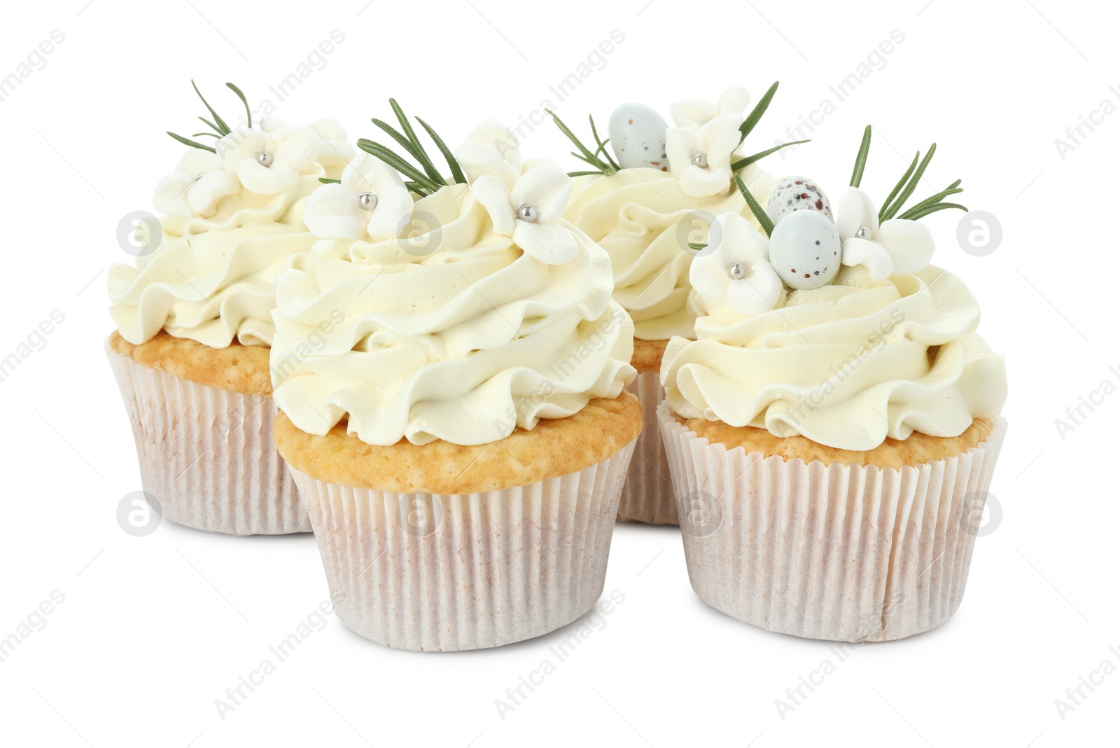 Photo of Tasty Easter cupcakes with vanilla cream isolated on white