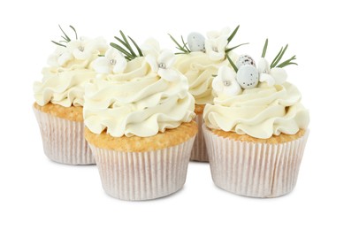 Photo of Tasty Easter cupcakes with vanilla cream isolated on white