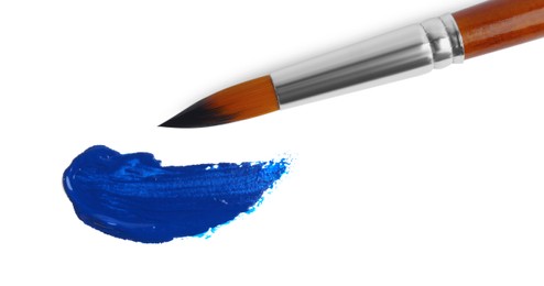 Photo of Paint stroke and brush on white background, flat lay