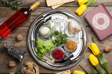 Flat lay composition with symbolic Passover (Pesach) items on wooden background