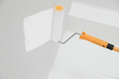 Photo of Painting ceiling with white dye indoors, space for text