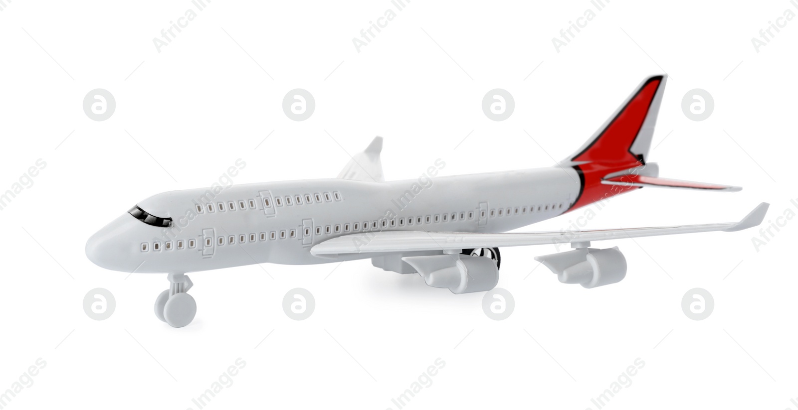 Photo of Toy plane isolated on white. Logistics and wholesale concept