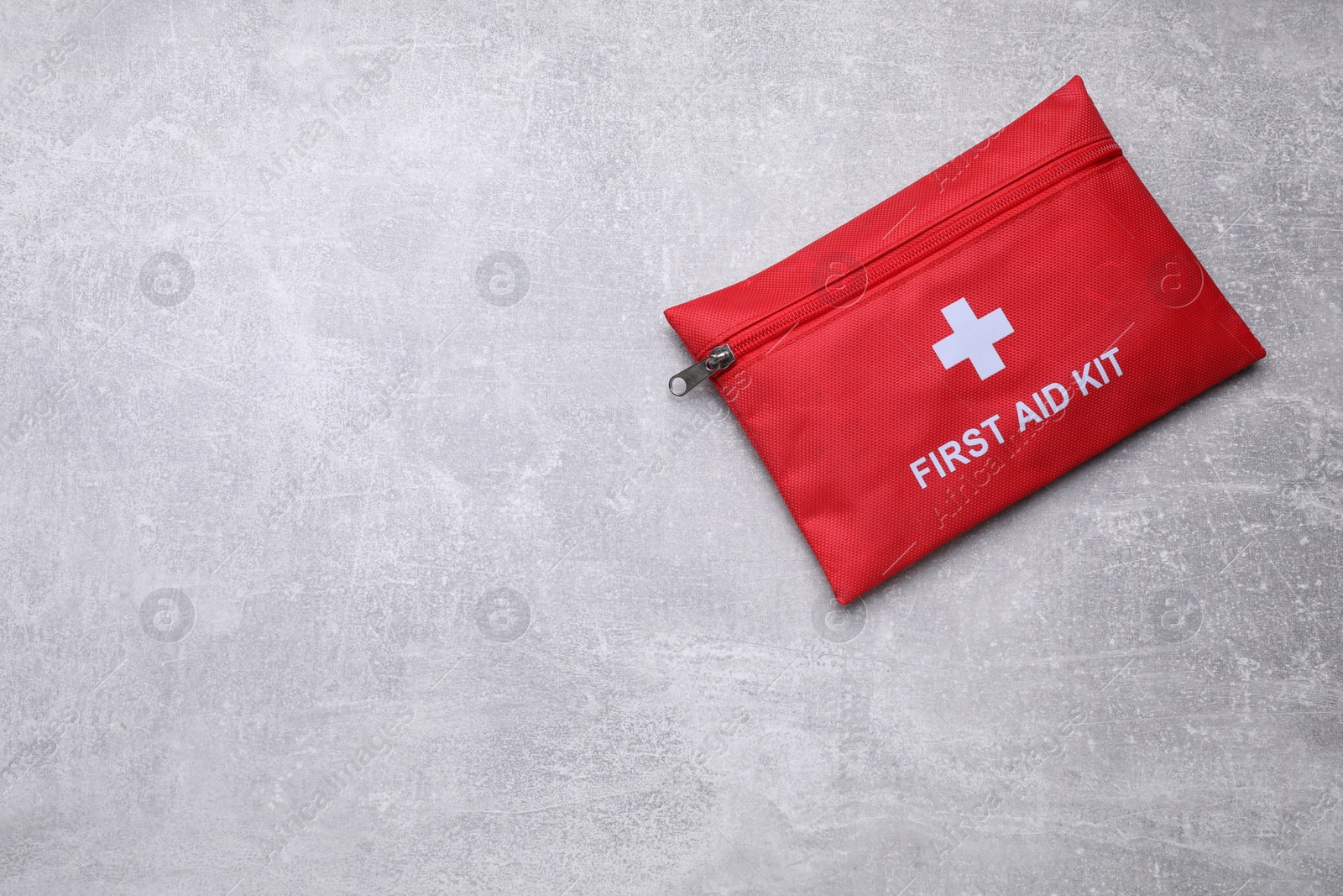 Photo of Medicine bag on light gray background, top view with space for text. First aid kit