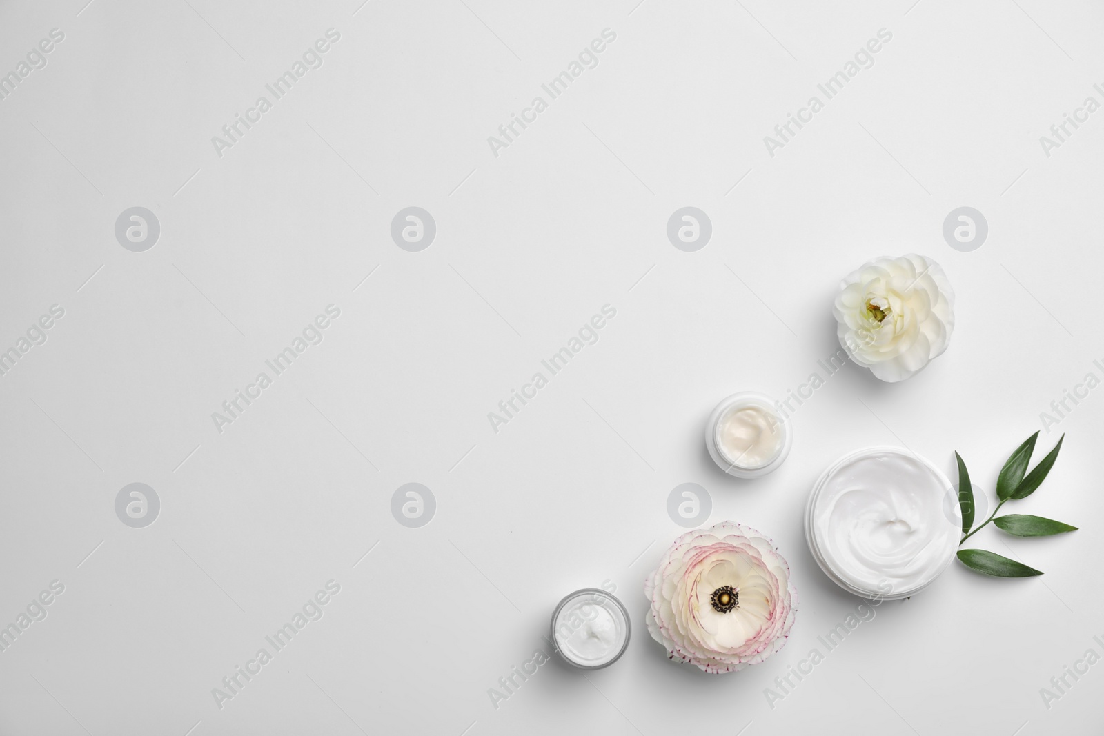 Photo of Flat lay composition with cosmetic products on light background