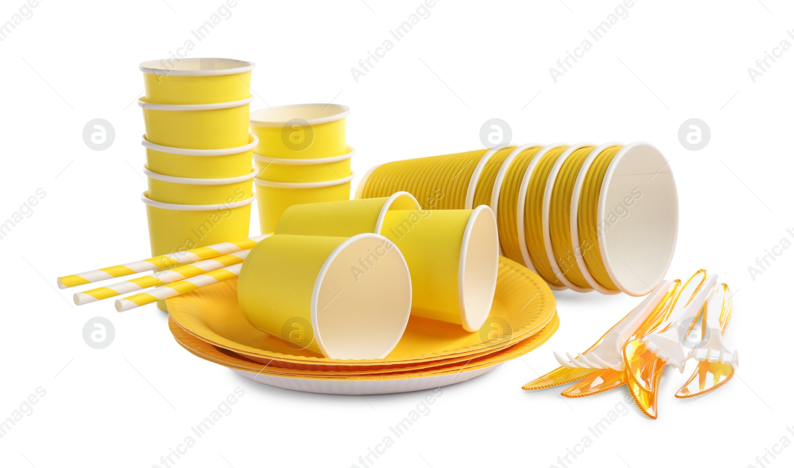 Photo of Set of bright disposable tableware on white background