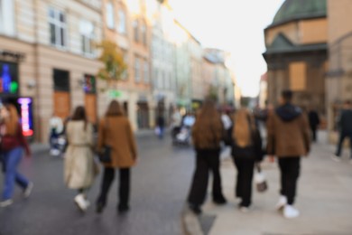 Blurred view of people walking on city street