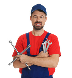 Photo of Portrait of professional auto mechanic with wrenches on white background