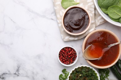 Photo of Different marinades and products on white marble table, flat lay. Space for text