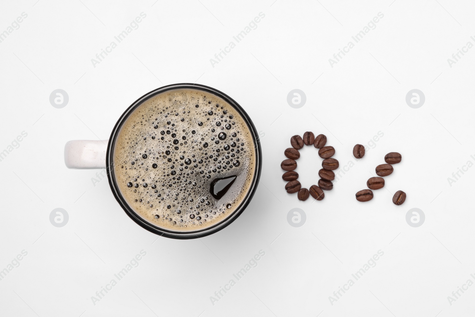 Photo of Cup of coffee and 0 percent made with beans on white background, top view. Decaffeinated drink