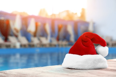 Authentic Santa Claus hat near pool at resort