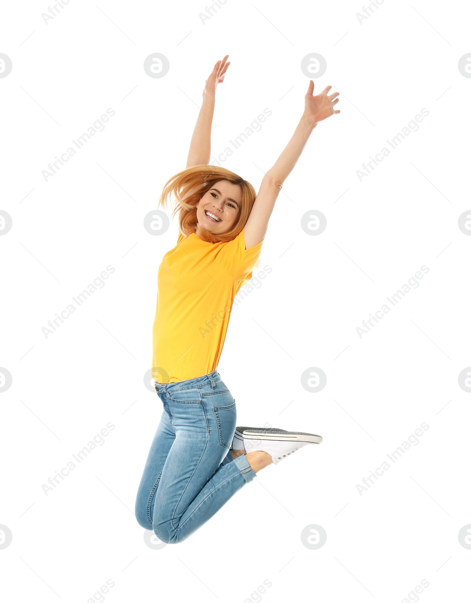 Photo of Full length portrait of happy beautiful woman jumping on white background