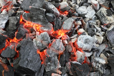 Many smoldering coals as background, top view