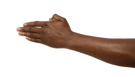 Photo of African-American man extending hand for shake on white background, closeup