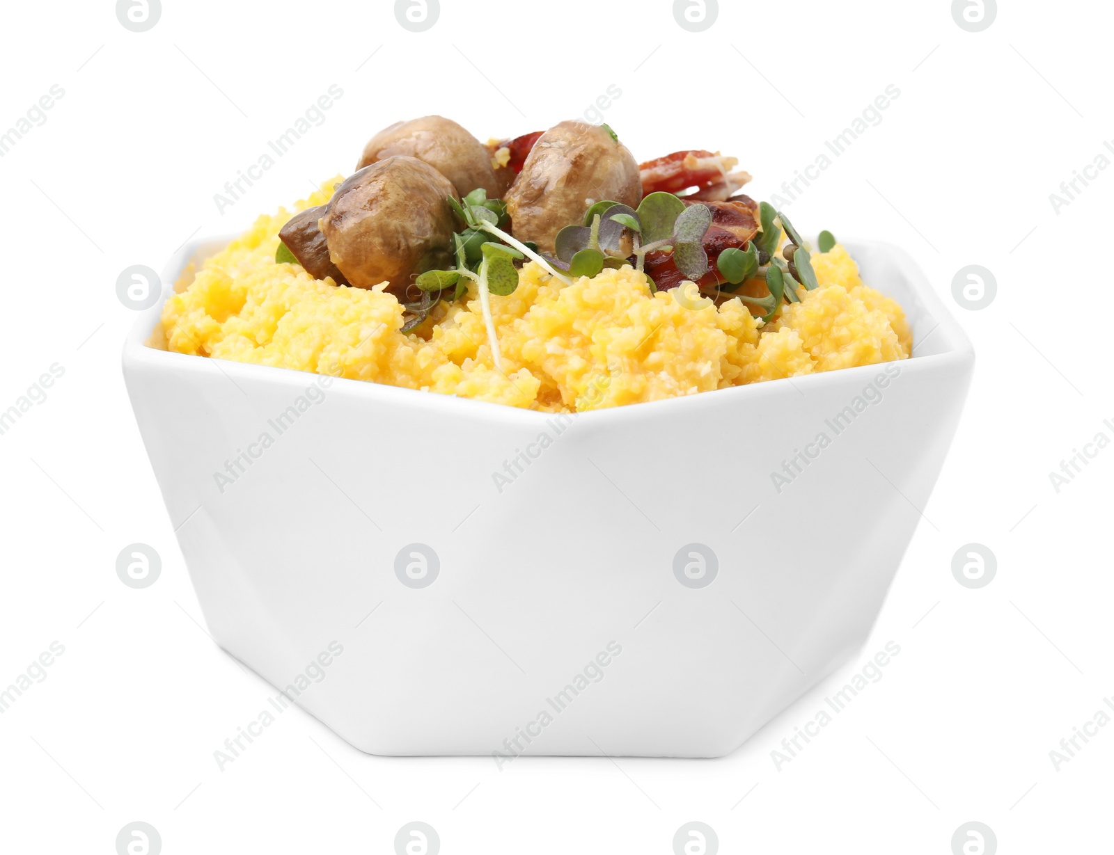 Photo of Cooked cornmeal with bacon, mushrooms and microgreens in bowl isolated on white