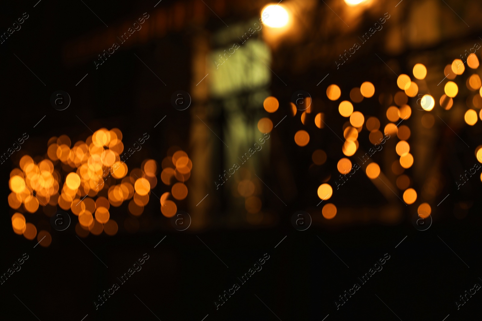 Photo of Beautiful street lights at night. Bokeh effect