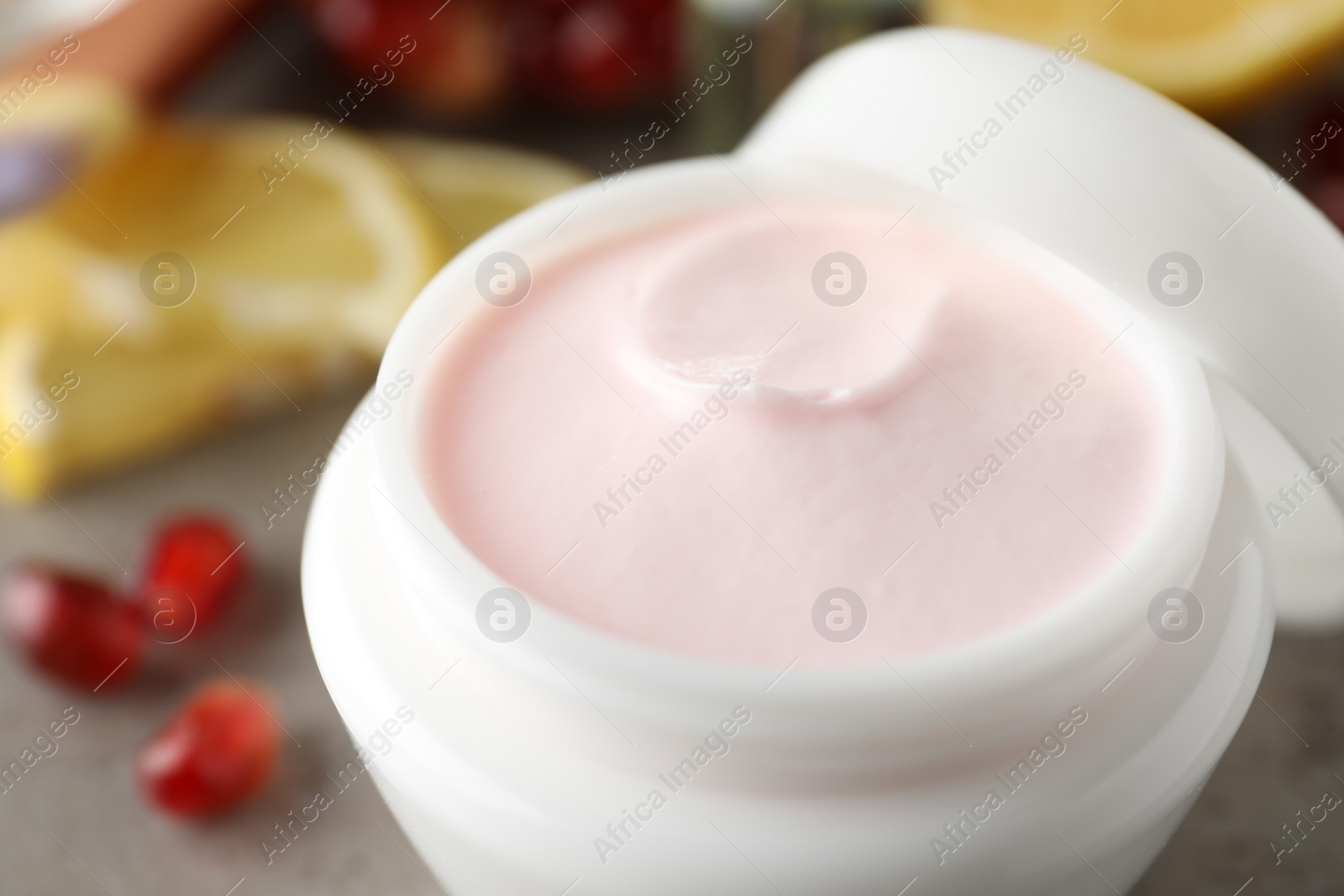 Photo of Natural pomegranate facial mask on table, closeup