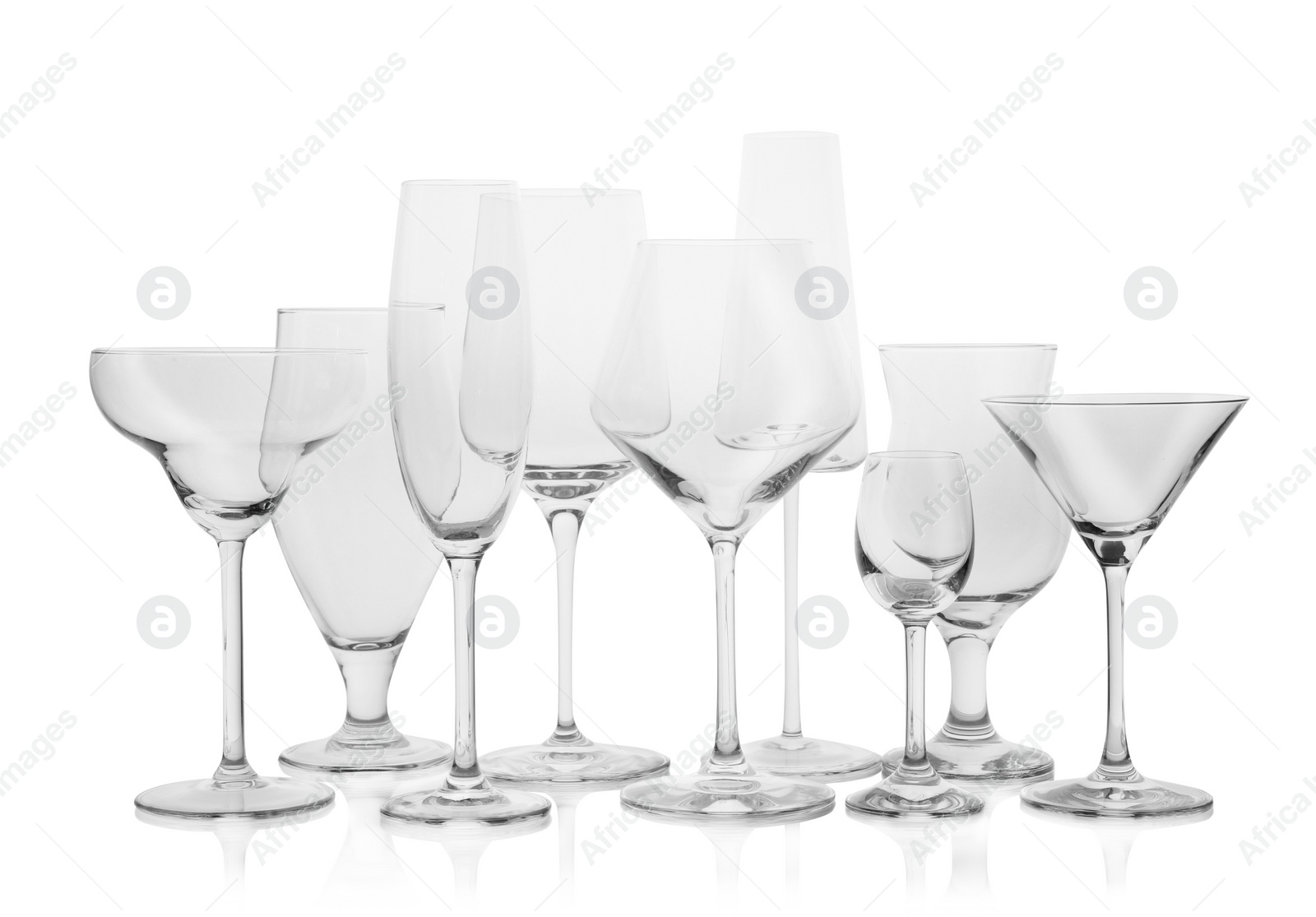 Photo of Set of empty glasses for different drinks on white background