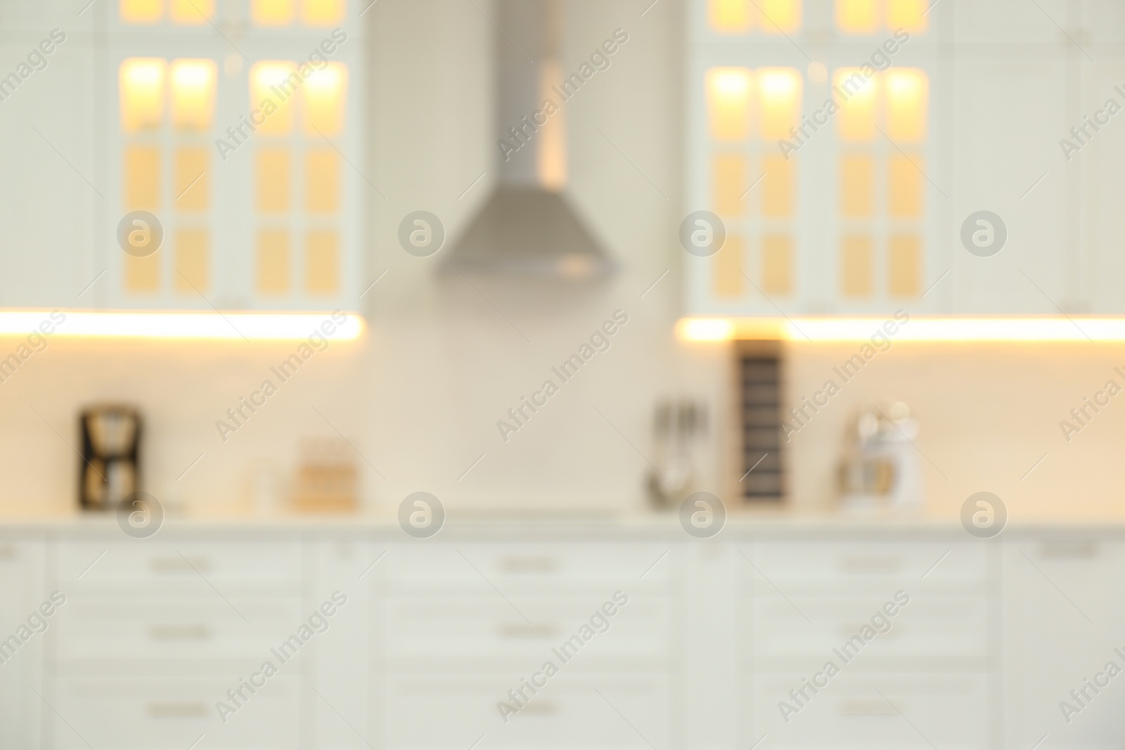 Photo of Blurred view of modern kitchen interior with stylish furniture