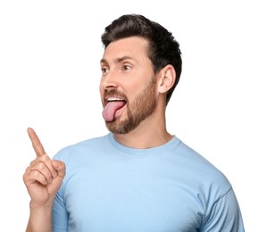 Photo of Man showing his tongue and pointing at something on white background